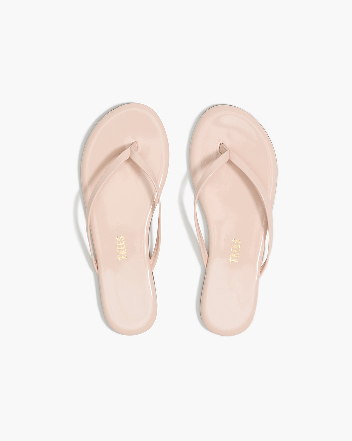 Lily Glosses Leather Flip Flops in Whipped Cream - TKEES