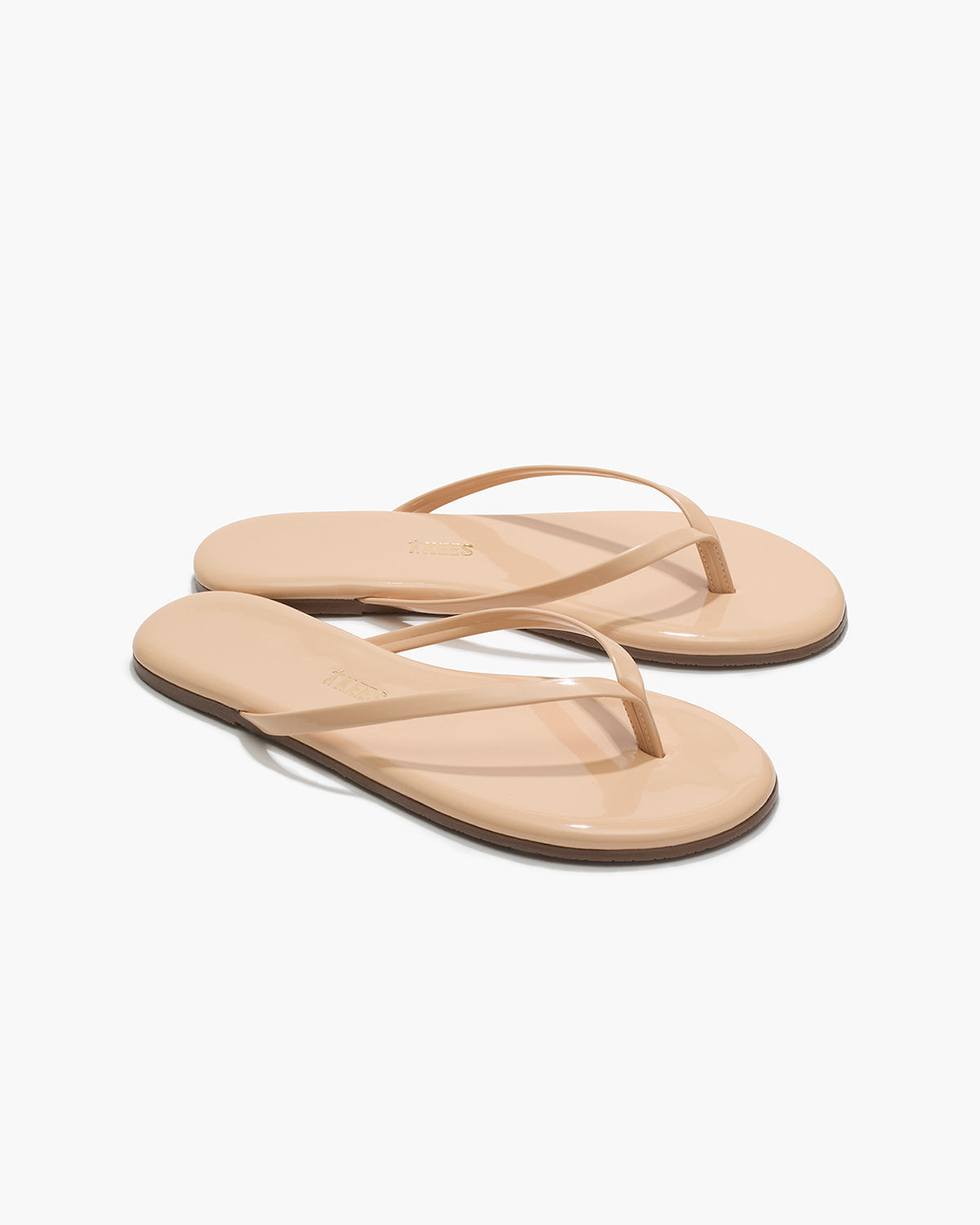 Lily Glosses Leather Flip Flops in Linen - TKEES